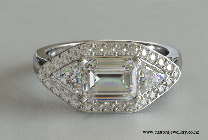 Emerald Cut Diamond with Trillion Sides Halo Three Stone Engagement Ring