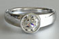 Brilliant Cut Diamond Solitaire Engagement Ring Rub Over Setting