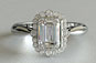 Vintage Emerald and Round Cut Diamond Engagement Ring