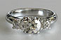 Three Stone Brilliant Cut Lucida Style Crossover Ring
